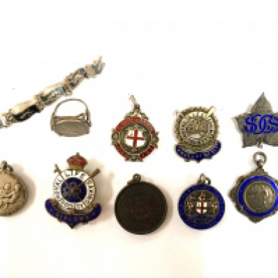 A collection of Royal Life Saving society award badges. (A)