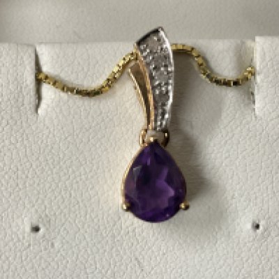9ct yellow gold pear shaped amethyst pendant with a diamond set bale on a gold plated silver chain, boxed. Amethyst 1.00ct approx. Diamonds 0.05ct approx. Postage category A.