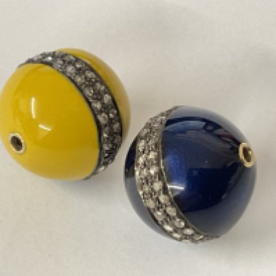 A pair of yellow and blue enamel beads set with diamonds totalling 0.50ct. Postage category A.