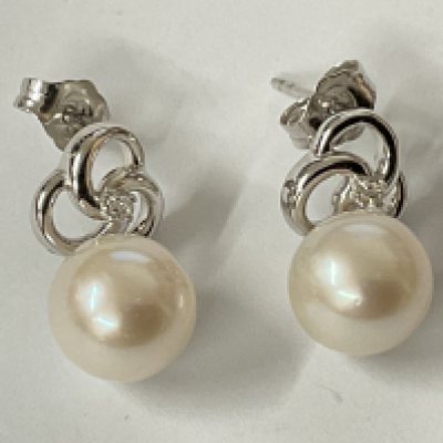Pair of 9ct white gold round freshwater Pearl and diamond pinwheel earrings. R/C diamonds 0.05ct. Postage category A.