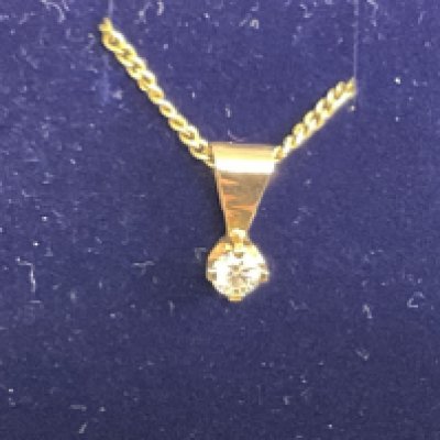 9ct yellow gold solitaire diamond pendant on a gold plated silver chain, boxed. RBC 0.15ct approx. Postage category A.
