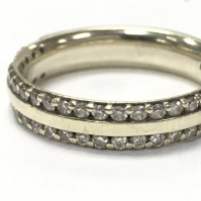 A 9ct gold double join half eternity ring , two stones missing. Size N. Total weight 4.65g. Postage category a