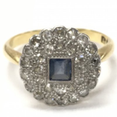An 18ct gold sapphire and diamond ring, size J/K. Total weight 3G. Postage category A