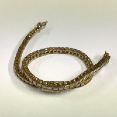 A 9ct gold CZ tennis bracelet, 7.12g (A)