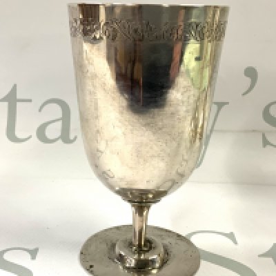 An unmarked early silver chalice (tested) with engraved border. 13cm. (Total weight 192g)