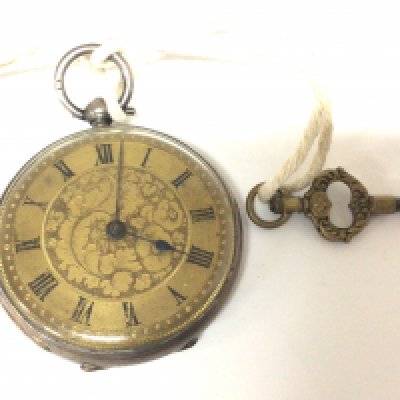 A silver cased key wind pocket watch with an elaborate dial. Seen working