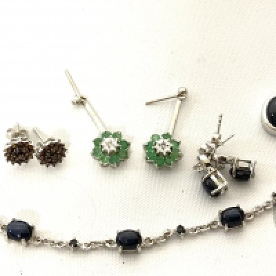 A small collection of silver and stone set jewellery to include a white gold emerald and diamond drop earrings. (A)