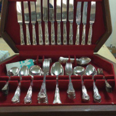 A cased canteen of kings cutlery and one other cutlery set .