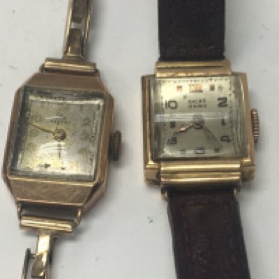 Two gold case wristwatches.