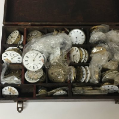 A box containing a large quantity of watch movements