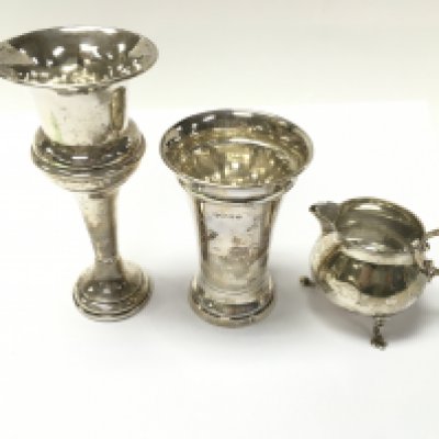 A collection of three items of silver including jug and vases. Total weight 276g. Postage B