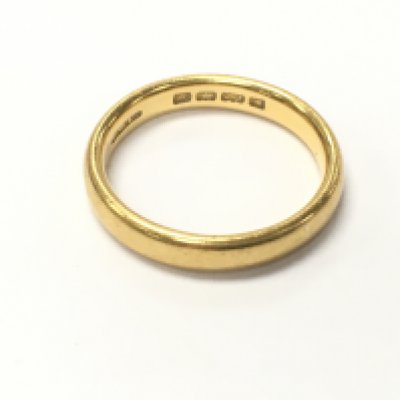 A 22ct gold band. 5.15g size N Postage A