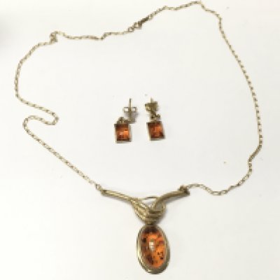 A 9ct gold amber necklace and earring set. Postage B