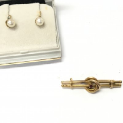 An 18ct gold brooch set with small ruby 2.87g and a pair of 9ct gold pearl earrings. Postage B