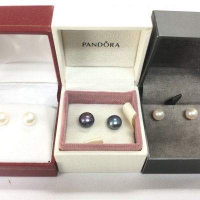 Three pairs of cultured pearl earrings. Shipping category A.