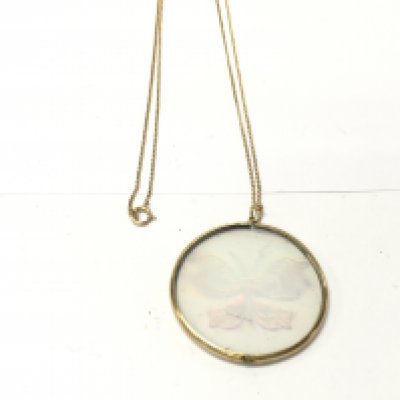A 9ct gold chain with a butterfly hologram pendant. 8.6g total