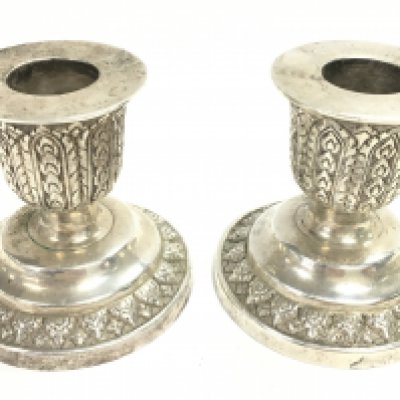 A pair of silver hallmarked candle sticks, 6.5cm tall. Postage category B. NO RESERVE