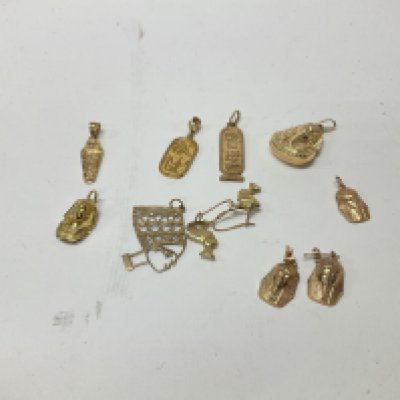 A collection of 9ct gold Egyptian pendants and earrings. Approx weight 11.25 grams.