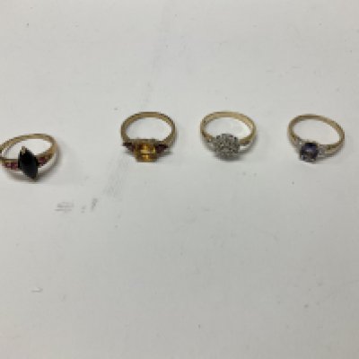 Four 9ct gold stone set rings, approx weight 9.62 grams.