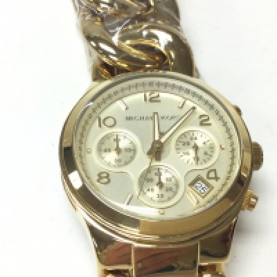 A Michael Kors yellow watch with a curblink bracelet. Seen working and in as new condition. Postage B