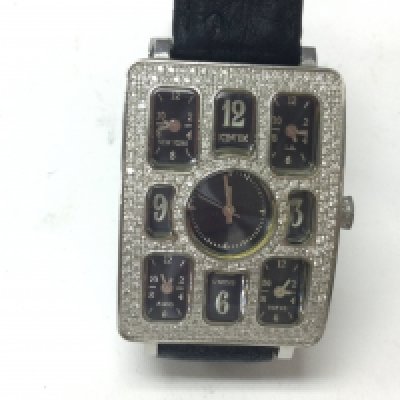 Ice Tek Quintempo diamond watch. Features 5 time zones watch controlled by separate quartz Swiss movements. 50mm face. 4ct diamonds on watch and 1ct on buckle. Postage B