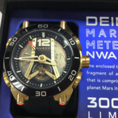 A Nubeo Ltd edition Martian meteorite automatic watch with box and paperwork. In excellent condition. Postage B