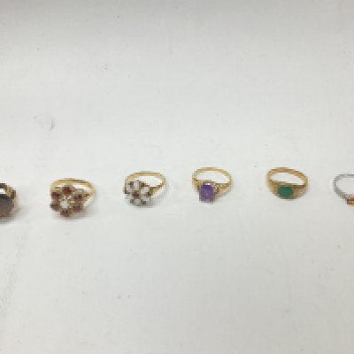 Six 9ct gold stone set ring, approx weight 19.41 grams.