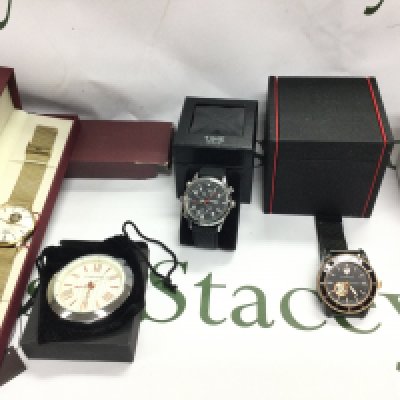 A Swiss eagle gents automatic wrist watch and a Henry of London automatic watch both in excellent condition seen running. Also includes one other watch and a desk clock not seen running. Postage B