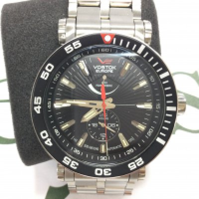 A Vostok Europe black rocket automatic wrist watch with spare strap. As new condition with box and papers. Postage B