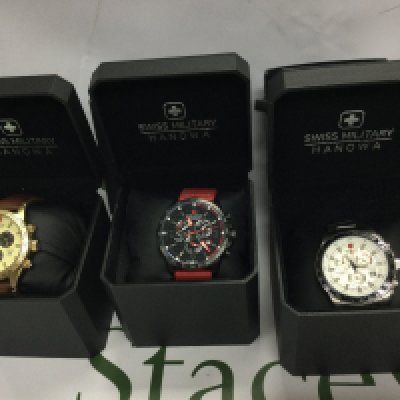 Three Swiss Military Hanowa wrist watches with boxes. Postage B