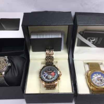 Two Swan and Edgar watches with boxes and paperwork seen running and a Kenneth Cole watch. Postage B