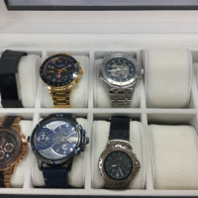 A small collection of watches including Swan and Edgar etc all in a 10 watch storage box. Postage B