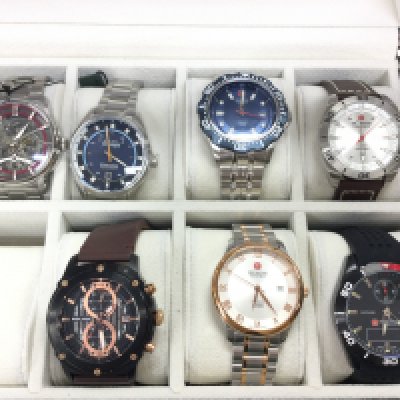 A small collection of watches including Swiss military and police etc all in a 10 watch storage box. Postage B