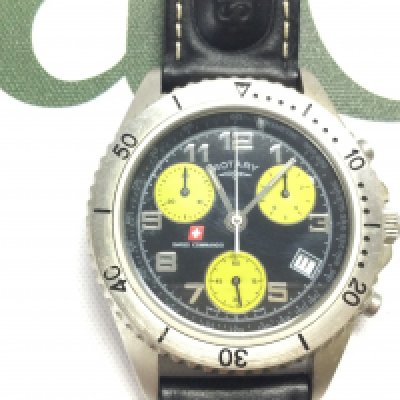 A Rotary Swiss commando Chronograph watch on black leather strap. Postage B