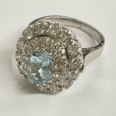 18ct white gold diamond and 1.25 aqua white gold diamond ring. Approx ring size I. Postage category A.