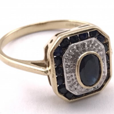 A 9 carat gold art deco ring inset with black sapphires and diamonds, ring size R. 3.13g total weight. Postage category A