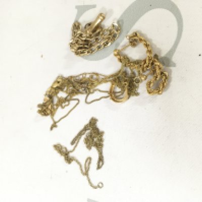 A collection of 9ct gold and yellow metal items including chains, bracelets and a pair of earrings.