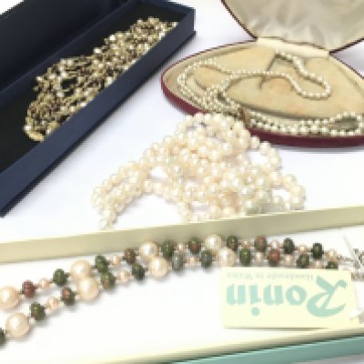 Simulated two strand pearl necklace with a 9ct gold clasp, pearls with a 14ct clasp and others. Postage category B