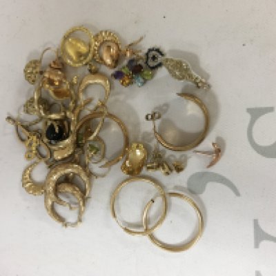 A collection of 9ct gold charms and earrings. Approx weight 26.80 grams.