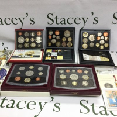 A collection of 5 United Kingdom proof coin sets and 5 queen beast &pound;5coins etc. Postage B