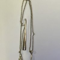 A sterling silver and black Tahitian pearl pendant together with an additional silver pendant. (A)