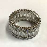 A steering silver and CZ eternity ring. Size S. (A)