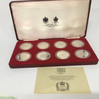 A cased set of eight silver 1977 commemorative coins in a fitted Spinks case with certificate of Authenticity. Each coin 28.2g (8)