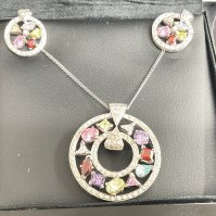 18ct gold 3 piece set, on 18ct chain. 2.83g, screw back earrings, 4ct 59 total diamond weight. Postage category A.