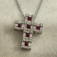 18ct diamond & ruby cross pendant. 18 platinum chain, 3.69g. 0.90ct rubies, 0.93ct diamonds. Postage category A.