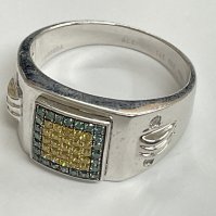 14ct white gold colour treated diamond ring, with 4 diamonds mounted in the shoulders. 0.50ct, 9.36g. Approx ring size U. Postage category A.