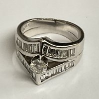 White gold diamond round ring, 0.30ct, baguette 0.60ct, 5.61g. Approx ring size H. Postage category A.