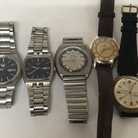 Five Vintage gents pocket watches the Seiko 5 day date Automatic seen working.