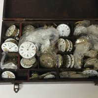A box containing a large quantity of watch movements