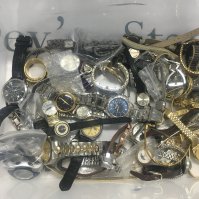 A plastic box of watches. Shipping category D.